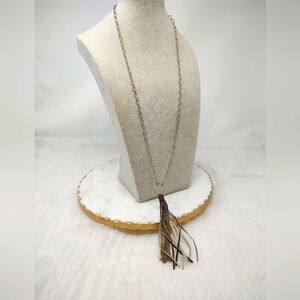 Envious long gold chain with brown leather and chain tassel pendant